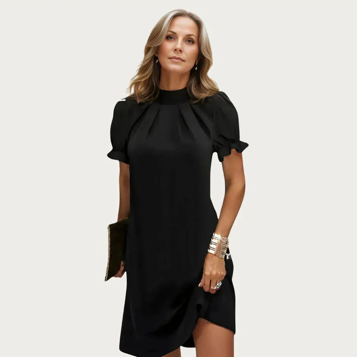 Black Women's Black Mini Dress — Marlow High Neck Puff Sleeve - Model Pose