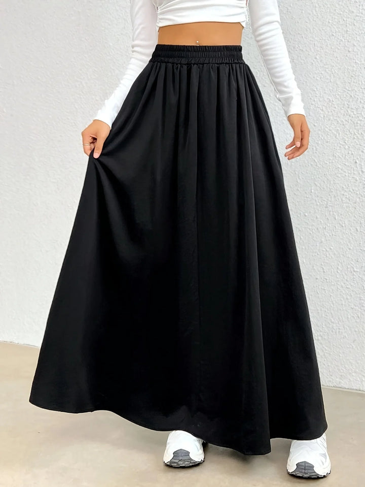 Black Women's High-Waist Flowing Black Maxi Skirt — Emerald Elastic Waist A-Line - Side Pose