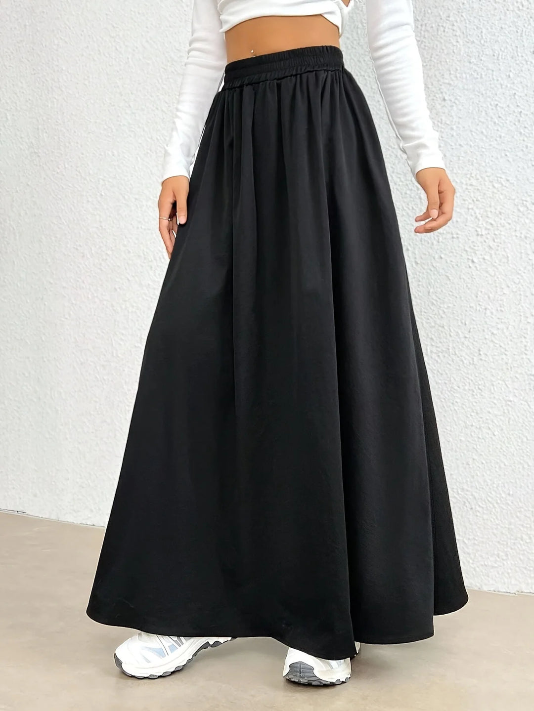 Black Women's High-Waist Flowing Black Maxi Skirt — Emerald Elastic Waist A-Line - Three Quarter View