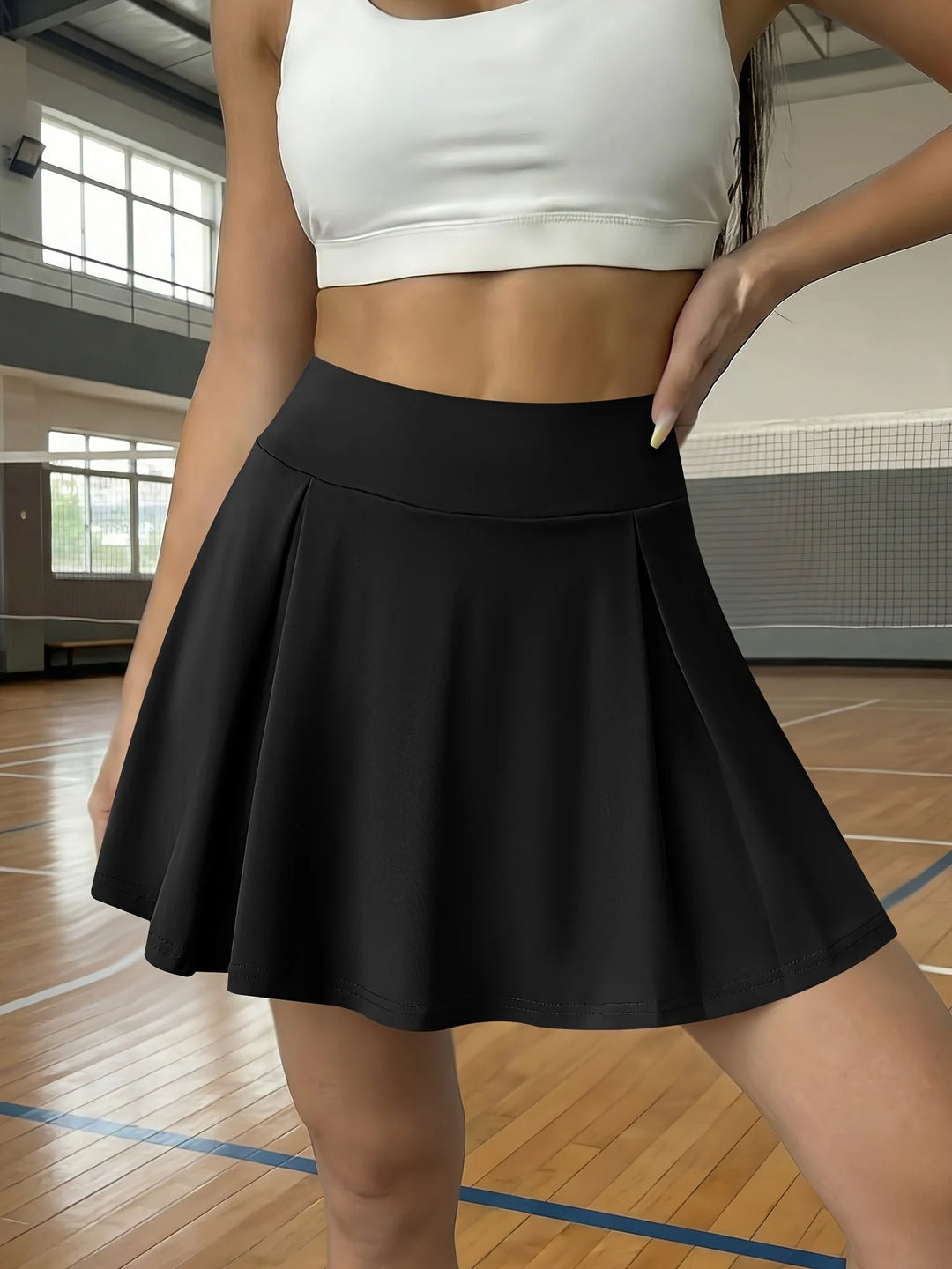 Black Women's Pleated High-Waist White Mini Skirt — Gloria Athletic Tennis - Athletic Pose