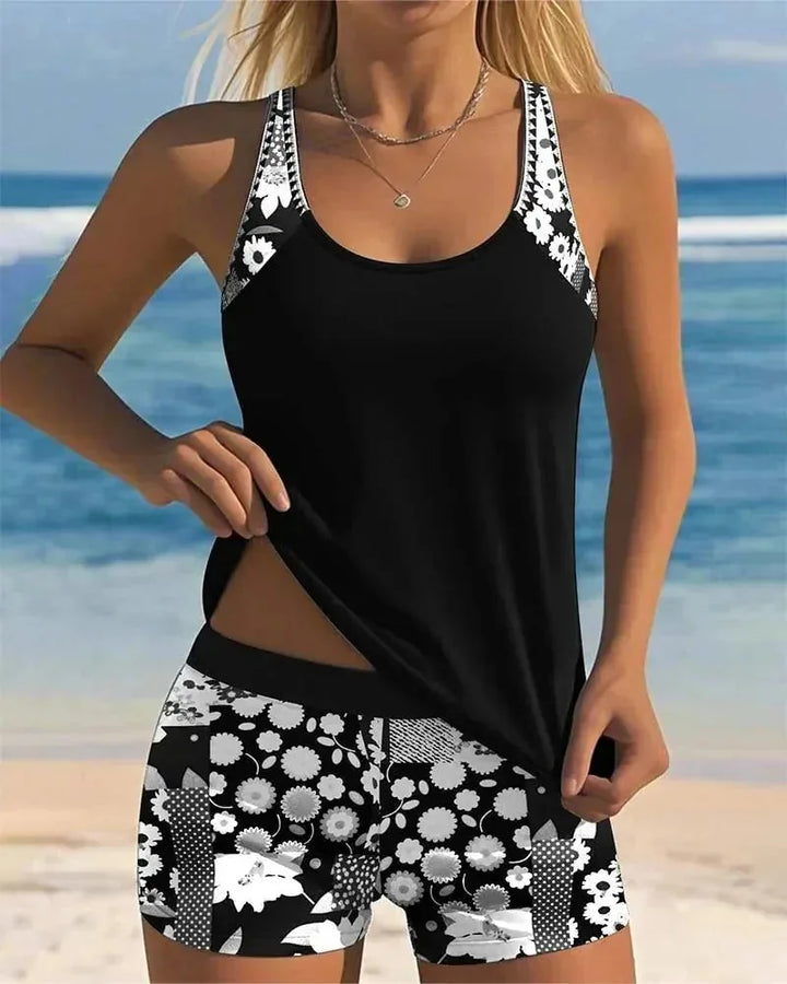 Black Women's Floral Print Tankini with Shorts — Tess Strappy Beach Two-Piece - Model Pose